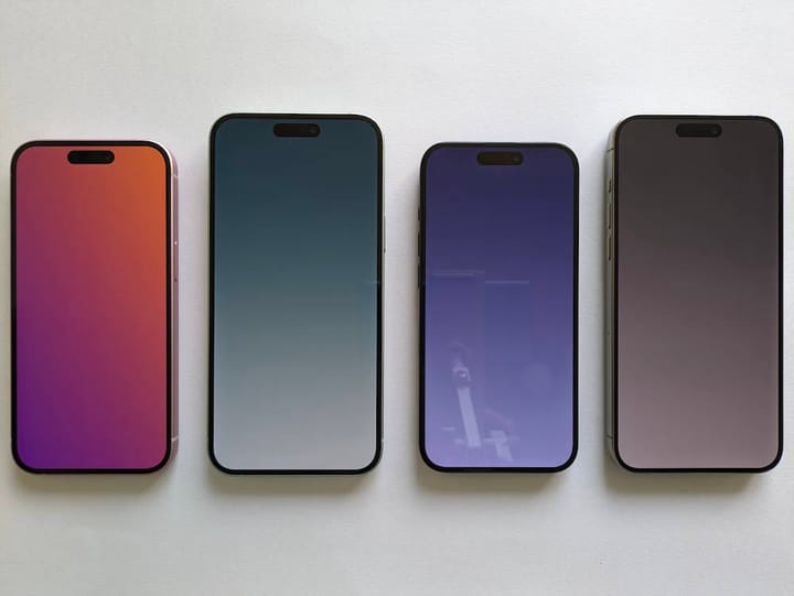 A decorative image showing four different iPhones